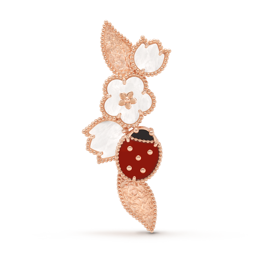 Van Cleef & Arpels Lucky Spring collection rose gold brooch featuring ladybug and flower motifs.