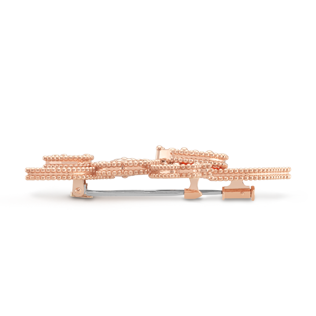Van Cleef & Arpels Lucky Spring collection rose gold brooch featuring ladybug and flower motifs.