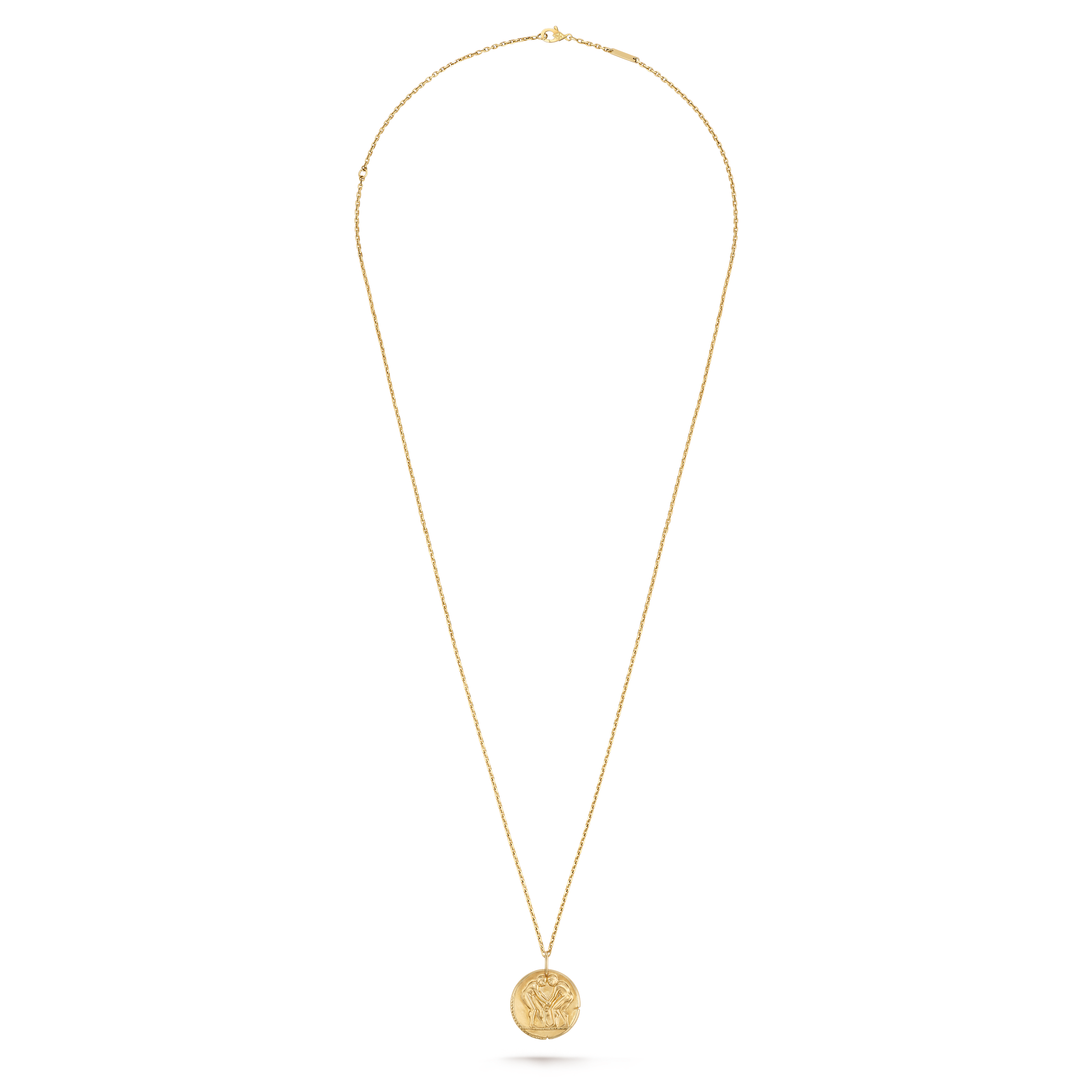 Van Cleef & Arpels Zodiaque Collection "Geminorum" (Gemini) gold medallion pendant featuring a relief design.