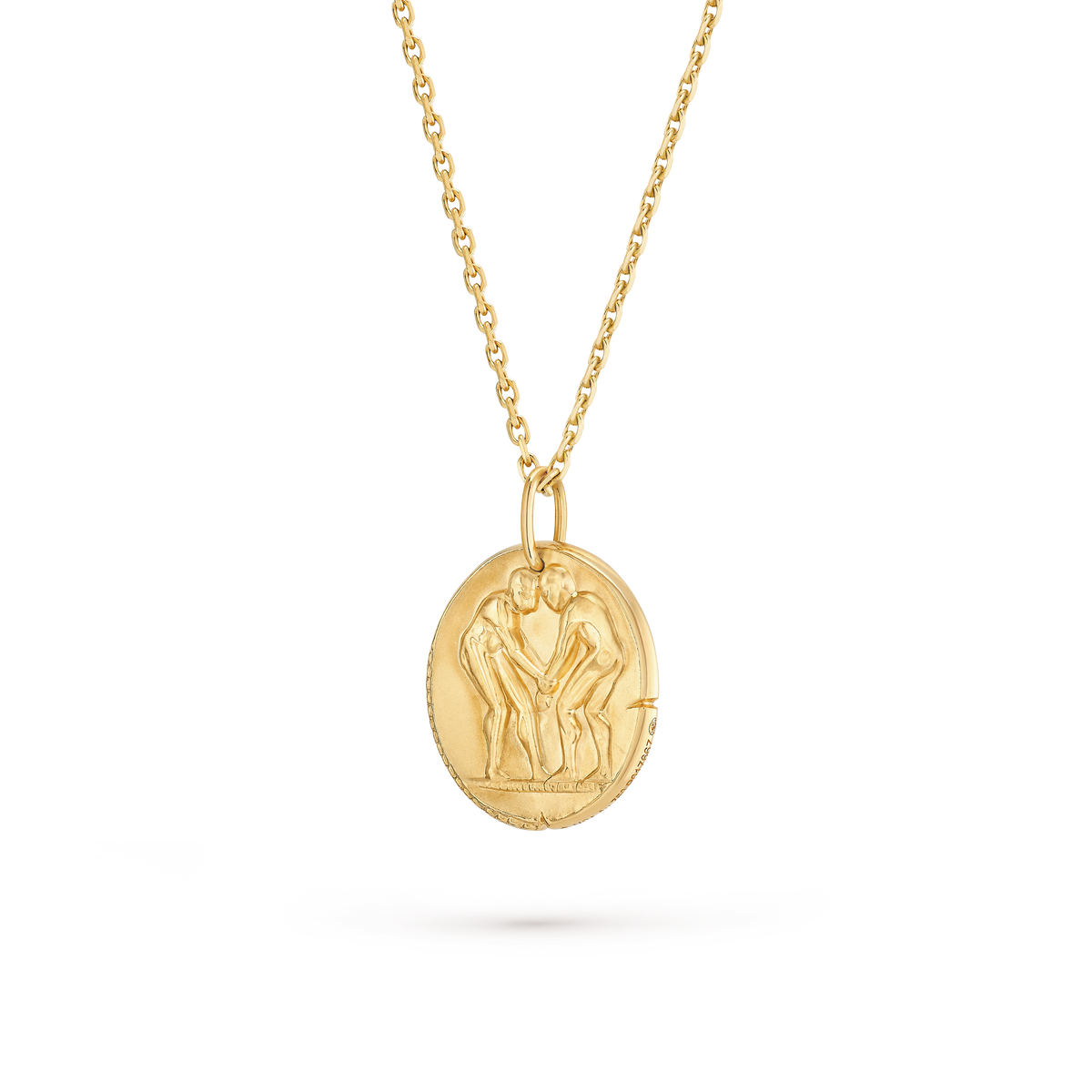 Van Cleef & Arpels Zodiaque Collection "Geminorum" (Gemini) gold medallion pendant featuring a relief design.
