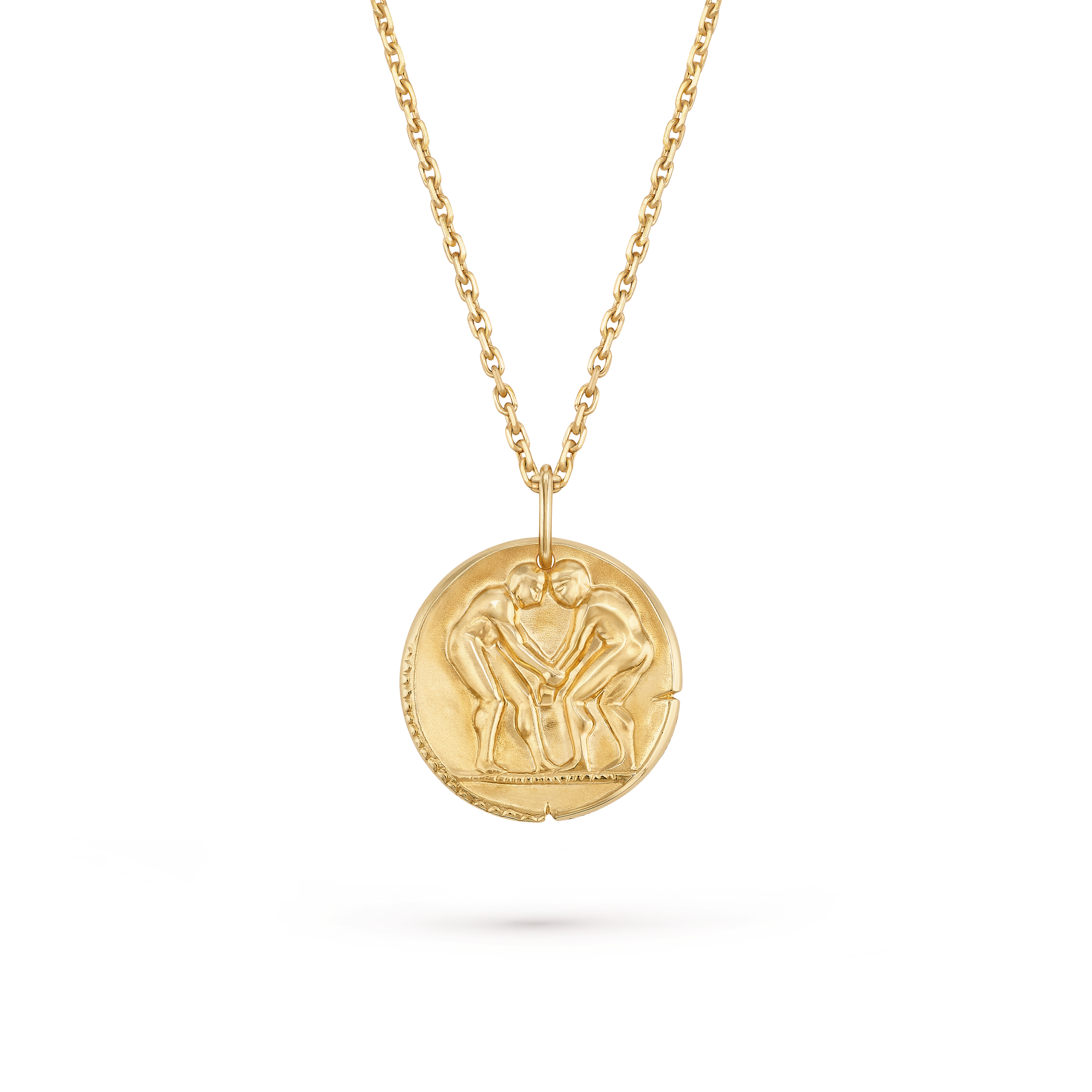 Van Cleef & Arpels Zodiaque Collection "Geminorum" (Gemini) gold medallion pendant featuring a relief design.