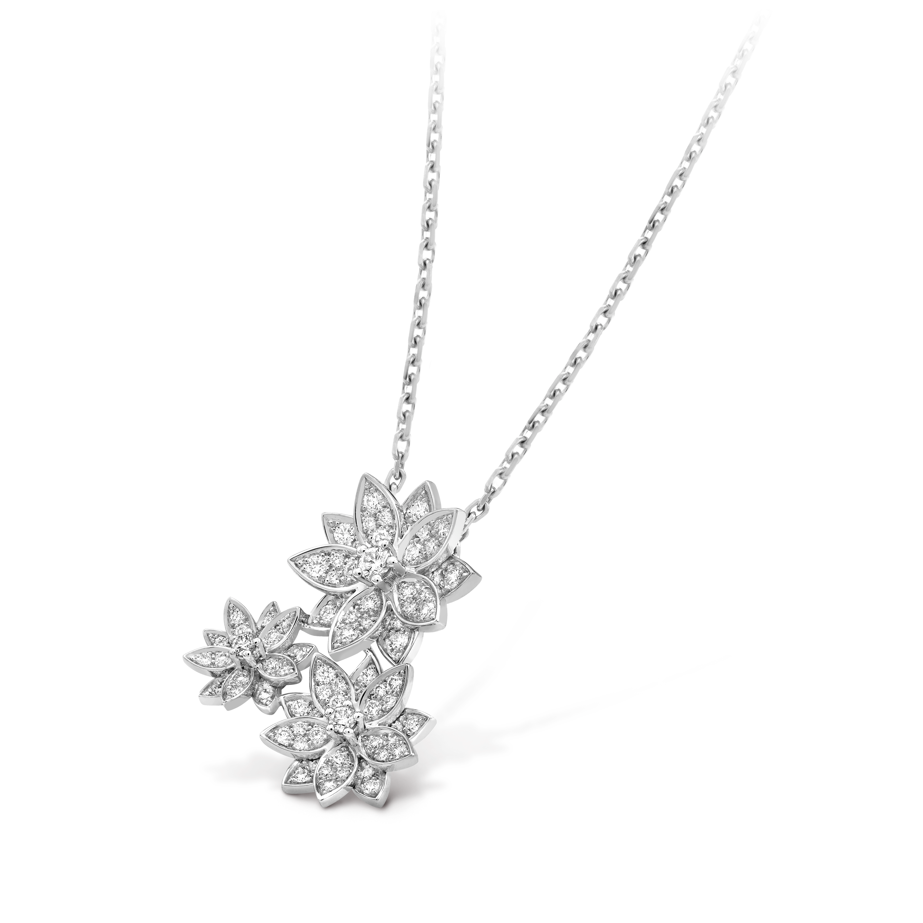 This is a Van Cleef & Arpels Cosmos collection pendant necklace in white gold featuring three flower motifs.