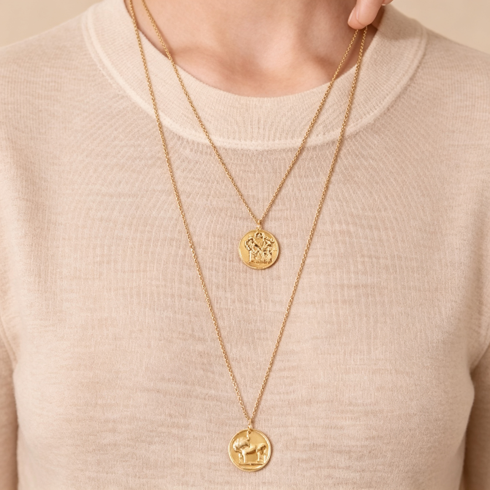 Van Cleef & Arpels Zodiaque Collection "Geminorum" (Gemini) gold medallion pendant featuring a relief design.