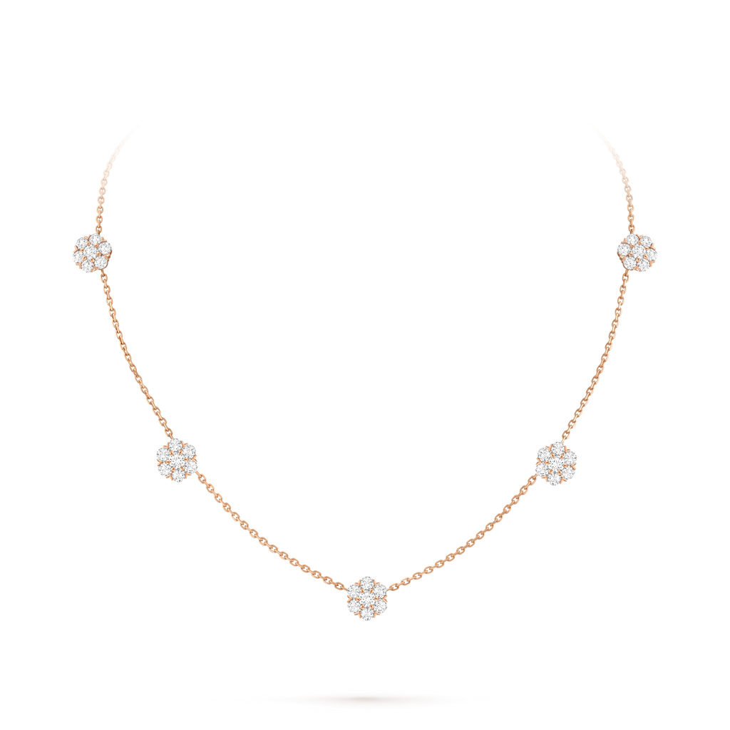 Van Cleef & Arpels Fleurette necklace featuring five diamond-pavé floral motifs.