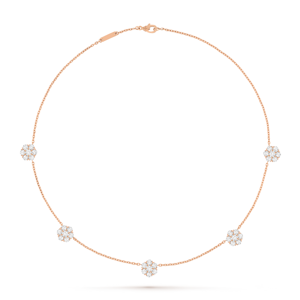 Van Cleef & Arpels Fleurette necklace featuring five diamond-pavé floral motifs.